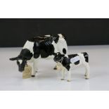 Border Fine Arts Holstein Friesian Cow A4600 with original paper label and a similar calf A4601