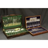 Oak cased set of fish knives and forks, together with a similar cased cutlery set