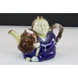Majolica Teapot, designed as an Oriental figure, approx 21.5cm long, marked "A" to base