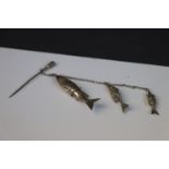 Three White Metal Graduating Articulated Fishes mounted on a chain with stick pin