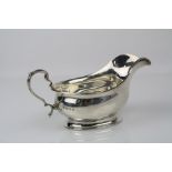 George V small silver footed sauce boat, crimped border, scroll handle, makers Adie Brothers Ltd,