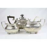 Early 20th century three piece silver tea service, comprising teapot, milk jug and twin handled