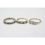 Emerald and white stones 9ct white gold eternity ring, one emerald missing, band width approximately