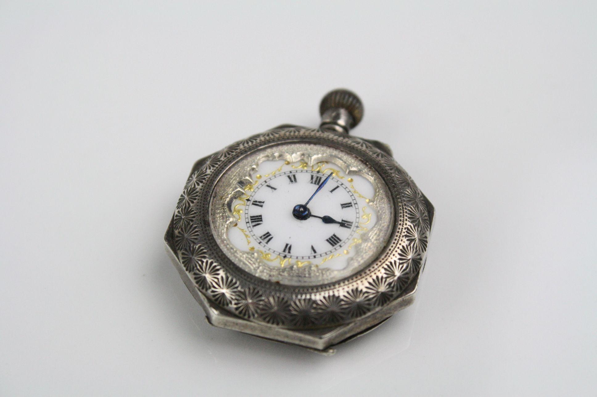 Early 20th century enamelled silver top wind hexagonal fob watch, white enamel dial with gilt