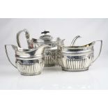 Matched three piece silver tea service comprising teapot, milk jug and twin handled sugar bowl,