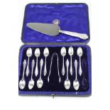 Eleven Edwardian silver coffee spoons, stylised tapered finials with scroll detail to reverse,