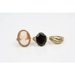 Smoky quartz 9ct yellow gold dress ring, ring size N; a shell cameo 9ct yellow gold ring, ring