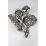 Silver backed hand mirror, cupid and maiden motif and mask decoration, makers Samuel M Levi,