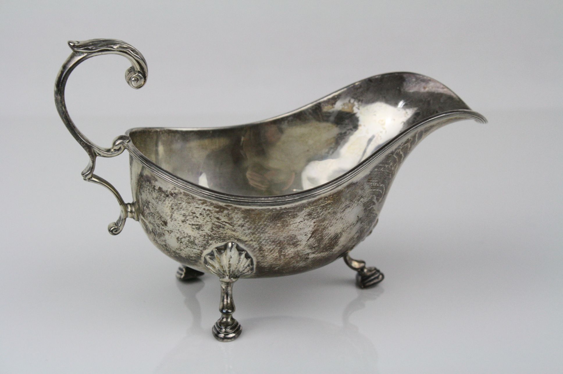 George V silver sauce boat raised on three hoof feet, shell shoulders, ribbed border, scroll handle - Image 2 of 3