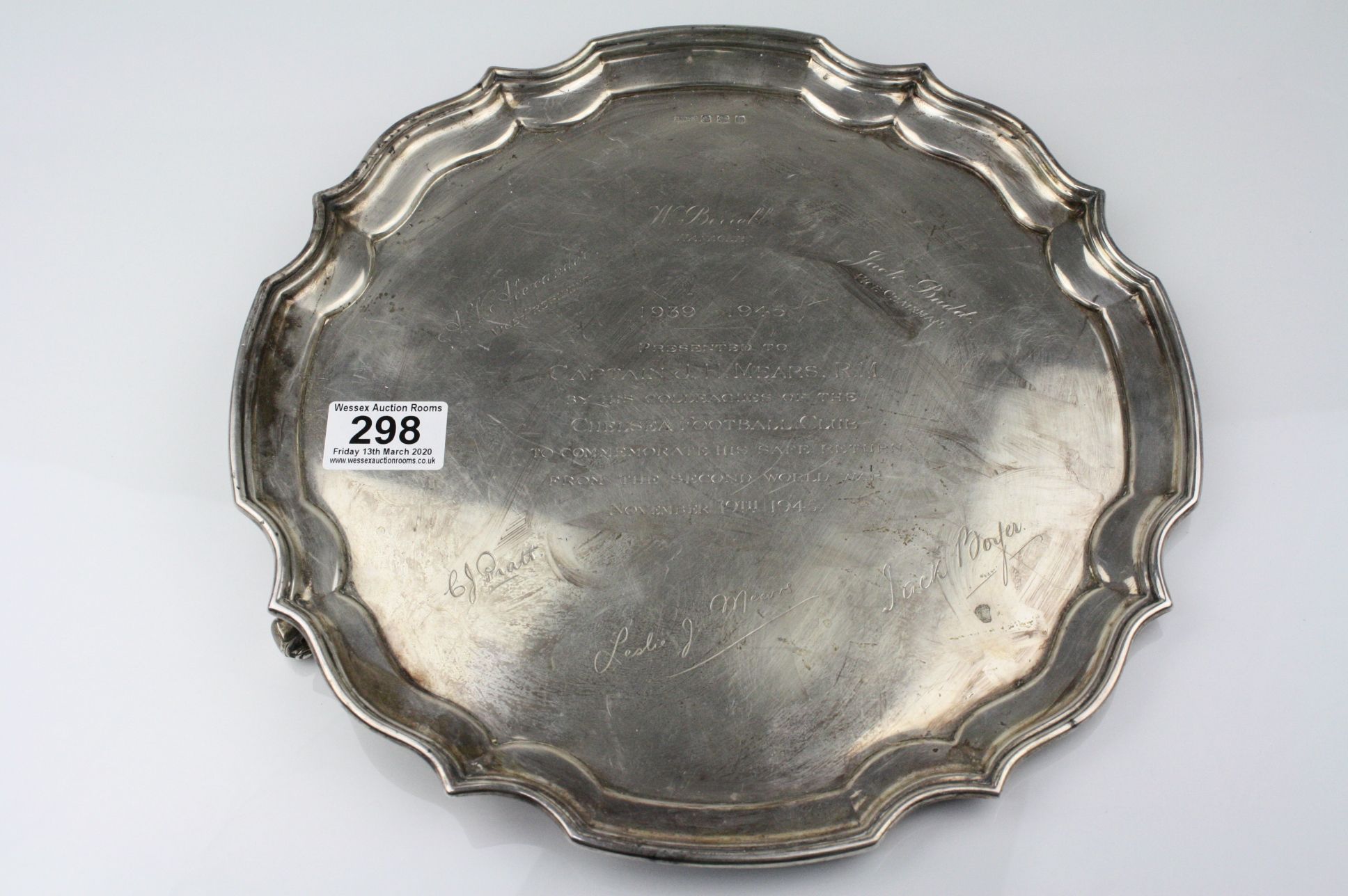 Silver salver raised on two scroll feet (one foot missing) with presentation inscription ' 1939-1945
