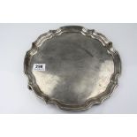 Silver salver raised on two scroll feet (one foot missing) with presentation inscription ' 1939-1945