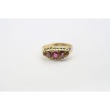 Early 20th century ruby 18ct yellow gold boat head ring, five graduated rubies, claw settings,