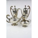 Five piece silver tea and coffee set comprising teapot, coffee pot, hot water pot, milk jug and