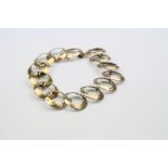 9ct yellow gold bracelet formed of interlocking circular panels, hook clasp, length approximately