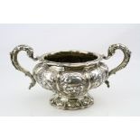 George IV silver twin handled sugar bowl, repoussé floral, berry and foliate decoration,