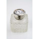 Edwardian silver topped cut glass inkwell with double faced top wind pocket watch set to lid, makers
