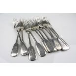 Twelve Russian silver fiddle pattern dessert forks, engraved monogram to terminal, combined standard