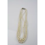 Three strand graduated cultured pearl necklace, small rose cut diamond set 9ct white gold hook and