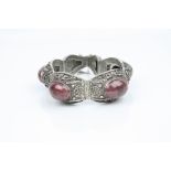 Rhondonite silver panel bracelet, four oval cabochon cut rhondonites, rub over setting, floral