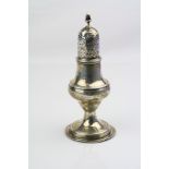 Silver pepperette, baluster form raised on moulded circular foot, banding to neck, waist and foot,