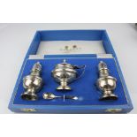 Garrard & Co Ltd silver cruet set comprising salt and pepper pots and mustard pot, the salt and