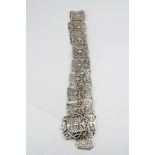 Edwardian Art Nouveau silver belt formed of eighteen pierced panels, stylised shell and scroll