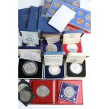 A collection of British proof commemorative cased coins to include year sets and silver proof