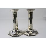 Pair of Edwardian silver candlesticks, plain polished octagonal form, moulded weighted foot,