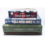 A large collection of British and World banknotes contained within a tin and two albums together