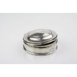 George V silver circular jewellery box, the moulded hinged lid with engine turned decoration to