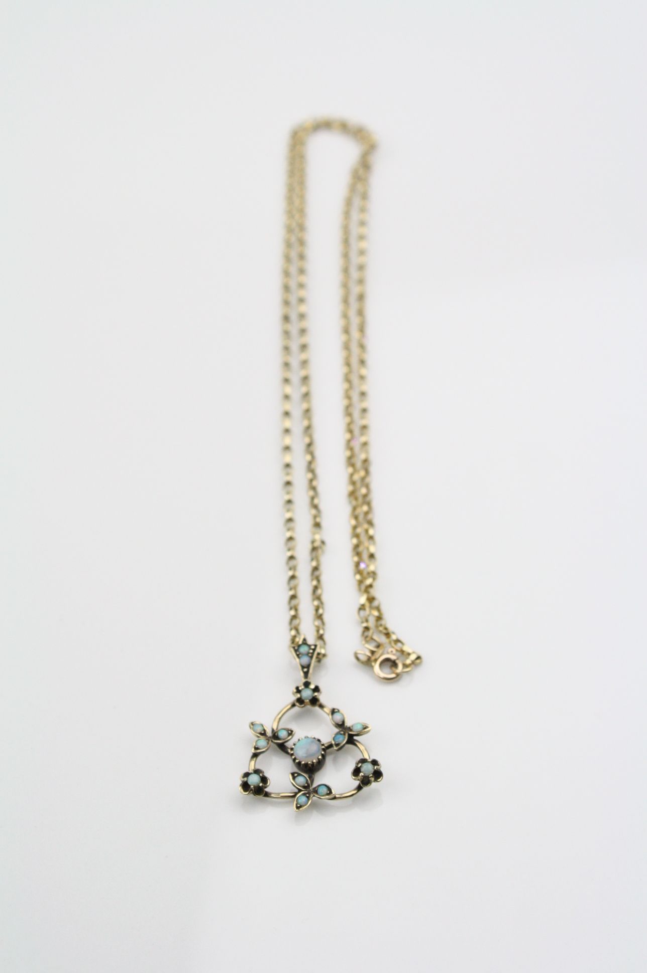 Opal 9ct yellow gold pendant necklace, the principle round cabochon cut precious white opal diameter