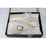 Unused silver backed dressing table brush set, comprising hand mirror, hair brush, comb and
