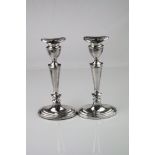 Pair of Elizabeth II silver candlesticks, urn shaped capital, removable sconces, tapered knopped