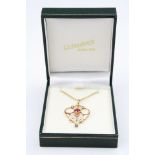Edwardian garnet topped doublet and seed pearl 9ct gold pendant, sinuous openwork design, the