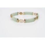 Jade 9ct yellow gold panel bracelet, five rectangular concave cabochon cut jade panels, each