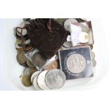 A collection of mixed British pre decimal and world coinage to include silver examples.