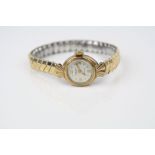 Ladies Excalibur 9ct gold cased wristwatch, champagne dial with gilt Arabic numerals and markers,