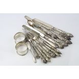 Set of six early Victorian silver fruit knives and forks, foliate scroll decorated handle, makers
