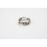 Jane Watling diamond 18ct white gold eternity ring, the open stylised shank with nine small round