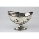 Victorian silver swing handled pedestal sugar bowl, the oval bowl with gadrooning to lower half,