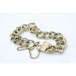 Yellow metal double link bracelet, patterned and plain polished links, cast floral decoration to