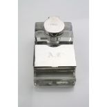 Silver cut glass inkstand of stepped form comprising silver lidded inkwell, silver lidded double