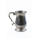 George III silver mug, plain polished body raised on moulded circular foot, scroll handle with