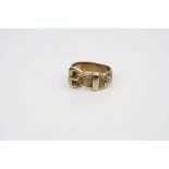 9ct yellow gold buckle ring, the band with engraved scroll decoration, band width approximately 11mm