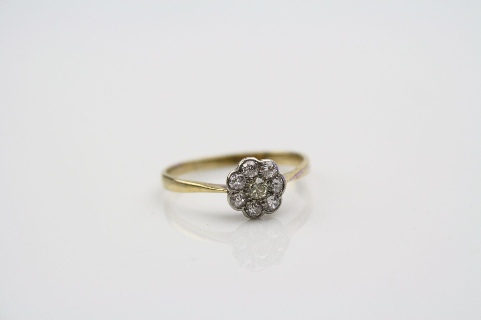 Yellow diamond 18ct yellow gold platinum set flower head cluster ring, the central round brilliant