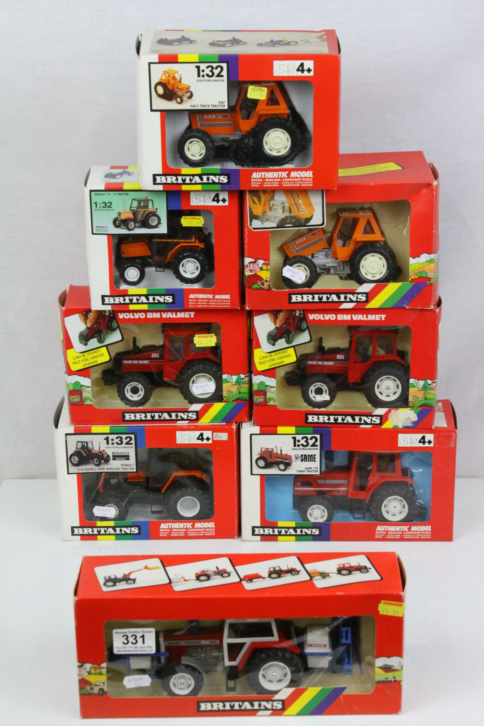 Eight boxed 1:32 Britains model tractors to include 9498 Renault TZ16 Double Rear Wheeled Tractor (