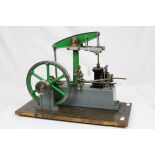 Stuart live steam single cylinder beam engine in green and grey livery on wooden base, base measures