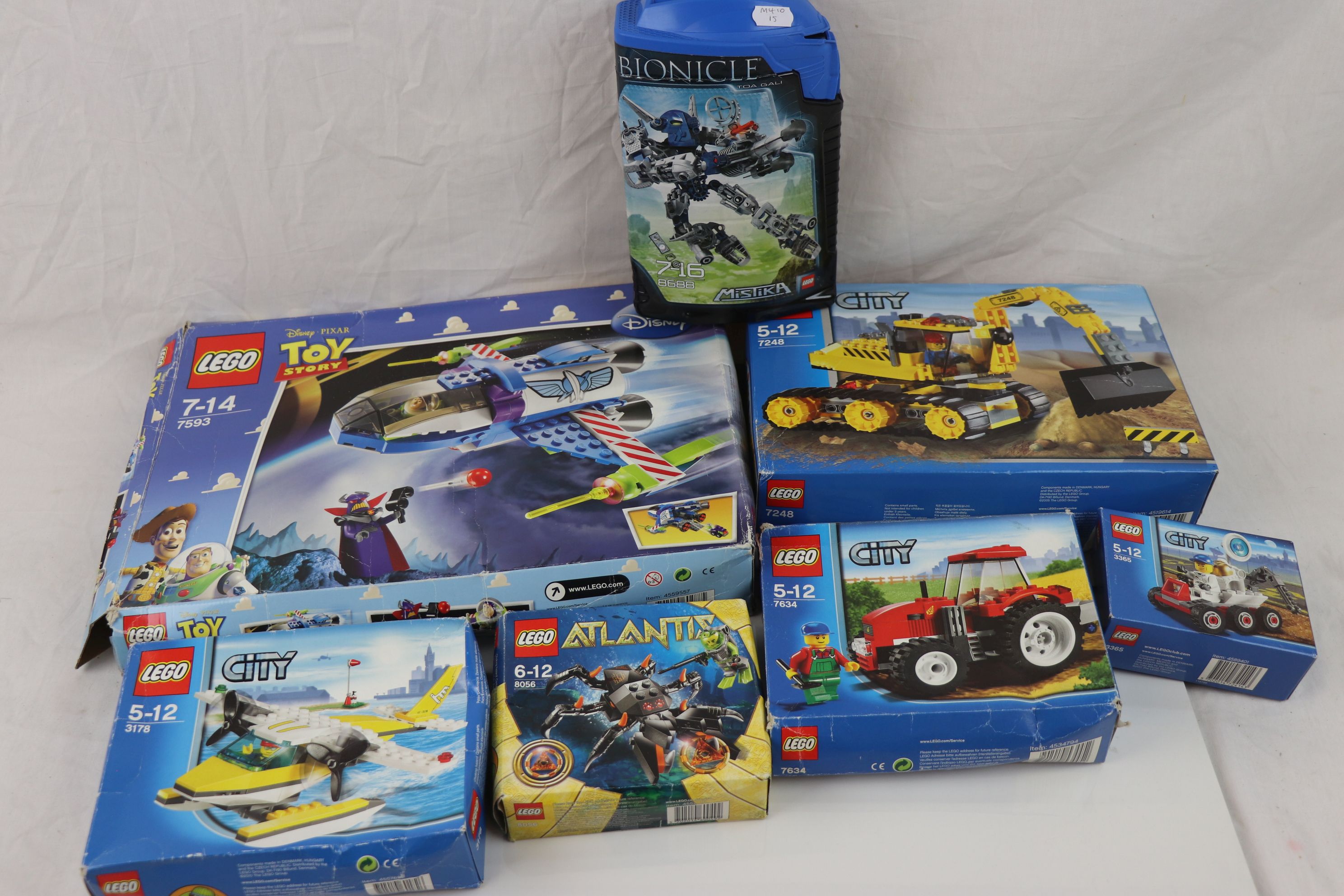 Seven boxed Lego sets to include Toy Story 7593, City x 4 (7248, 3365, 7634 & 3178), Atlantis 8056