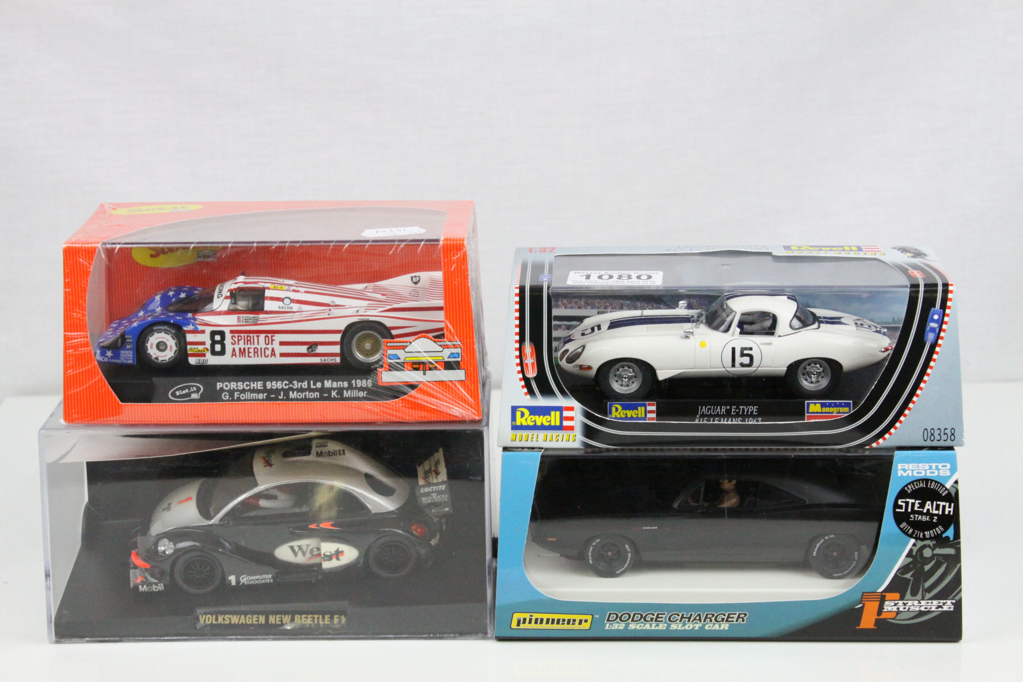 Four cased slot cars to include Special Edn Pioneer Street Muscles Dodge Charger, Revell Jaguar E-