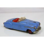 Original Schuco clockwork tin plate 4003 model motor car in blue with red hubs, with key, rusting